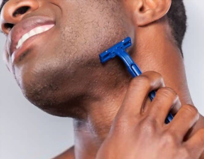 man has razor bumps while shaving